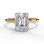 Emerald cut diamond engagement ring in yellow gold