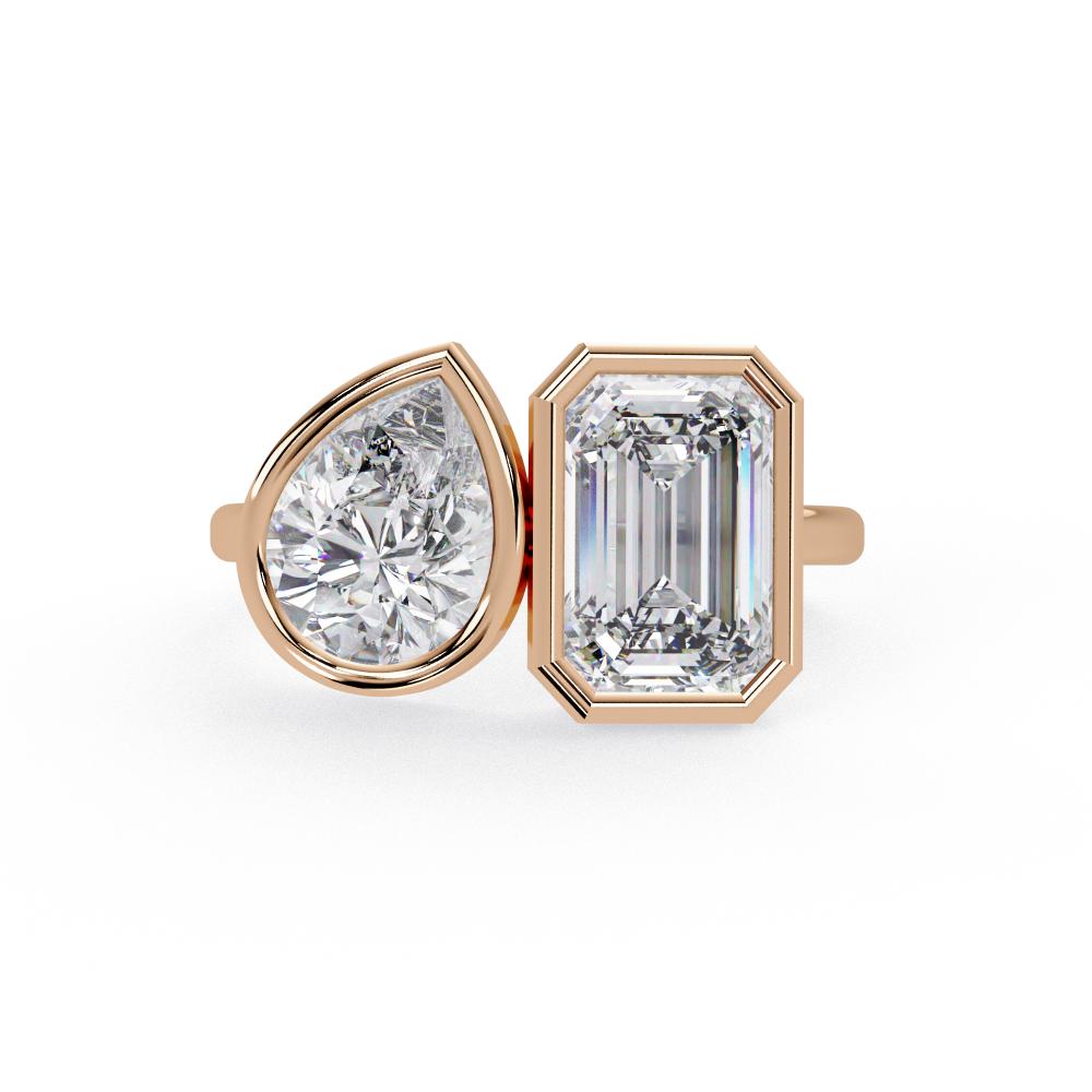 Emerald and pear diamond Toi et Moi bezel engagement ring in rose gold