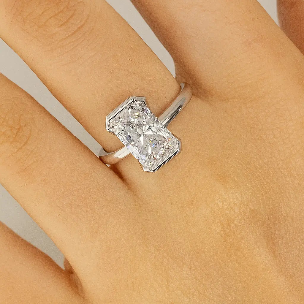 Woman wearing radiant cut diamond engagement ring