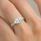 Woman wearing marquise cut diamond engagement ring