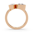 Rose gold ring with two diamonds on a white background