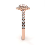 Rose gold ring with diamonds on a white background