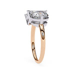 Elegant emerald and round diamond rose gold engagement ring design