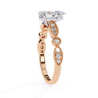 Elegant rose gold Milgrain Cathedral engagement ring with pear diamond