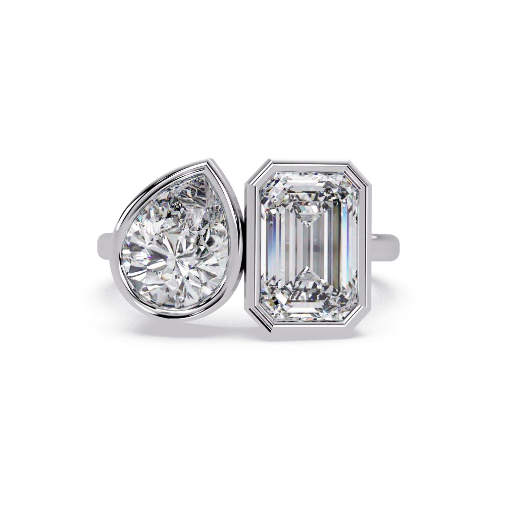 Emerald and pear diamond Toi et Moi bezel engagement ring in white gold
