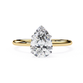 Pear cut diamond engagement ring in yellow gold