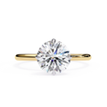 Round diamond engagement ring in yellow gold