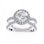Round halo diamond engagement ring in white gold with crossover design