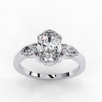 Oval shaped diamond engagement ring with pear side diamonds 