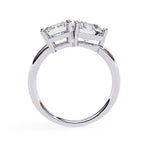 Affordable diamond Toi Et Moi engagement ring with emerald and round diamond
