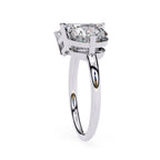 Elegant emerald and round diamond white gold engagement ring design
