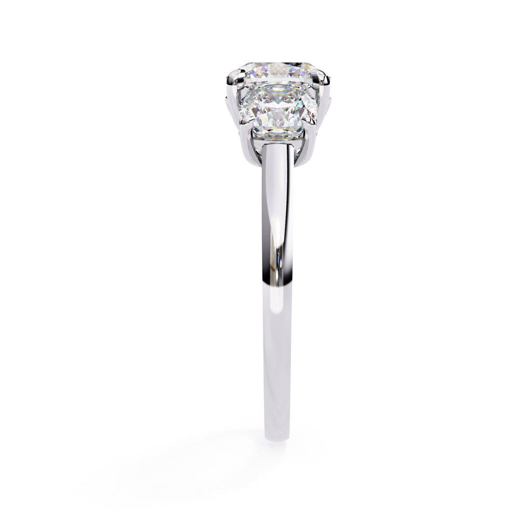 White Gold engagement ring featuring three cushion cut diamonds