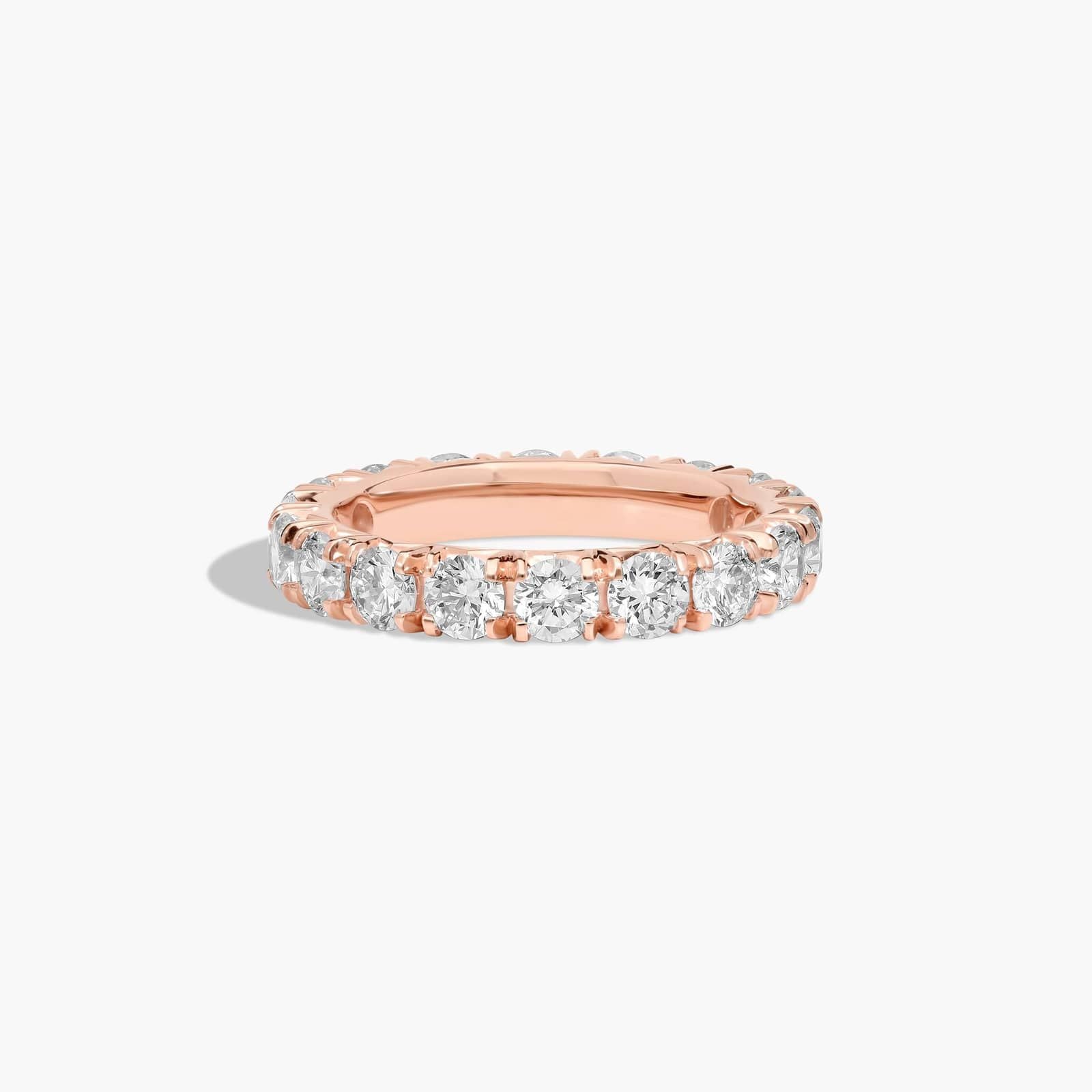 French pavé diamond wedding band in rose gold eternity style