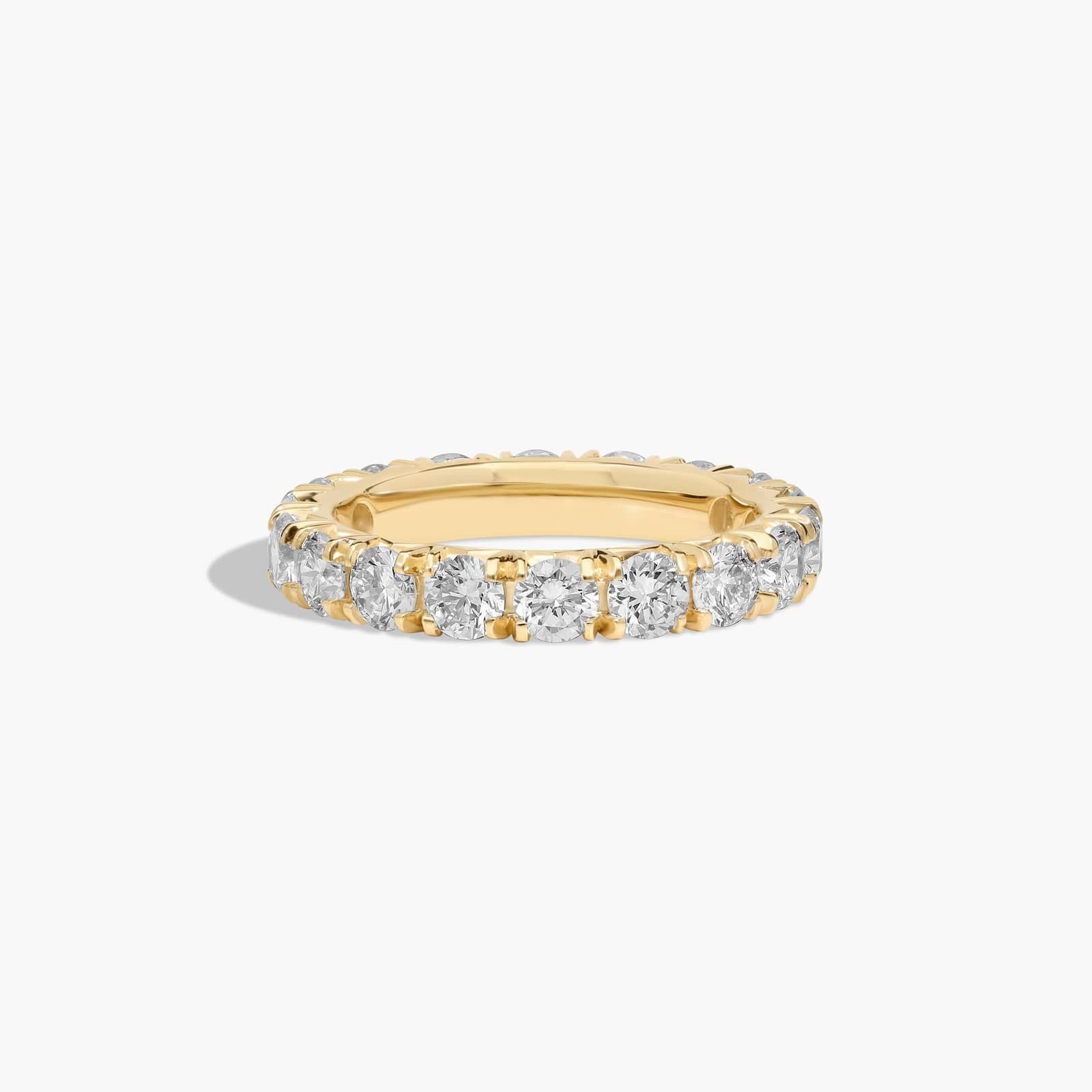French pavé diamond wedding band in gold eternity style
