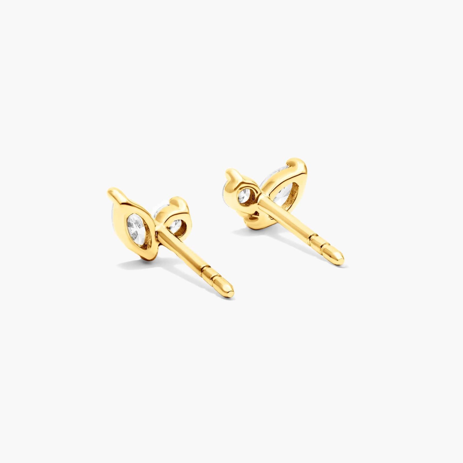 Delicate diamond stud earrings in yellow gold