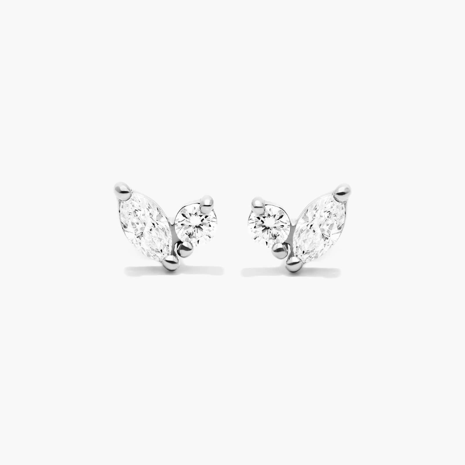 Marquise and round diamond stud earrings in white gold