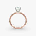 Petite pavé diamond engagement ring in rose gold with round diamond
