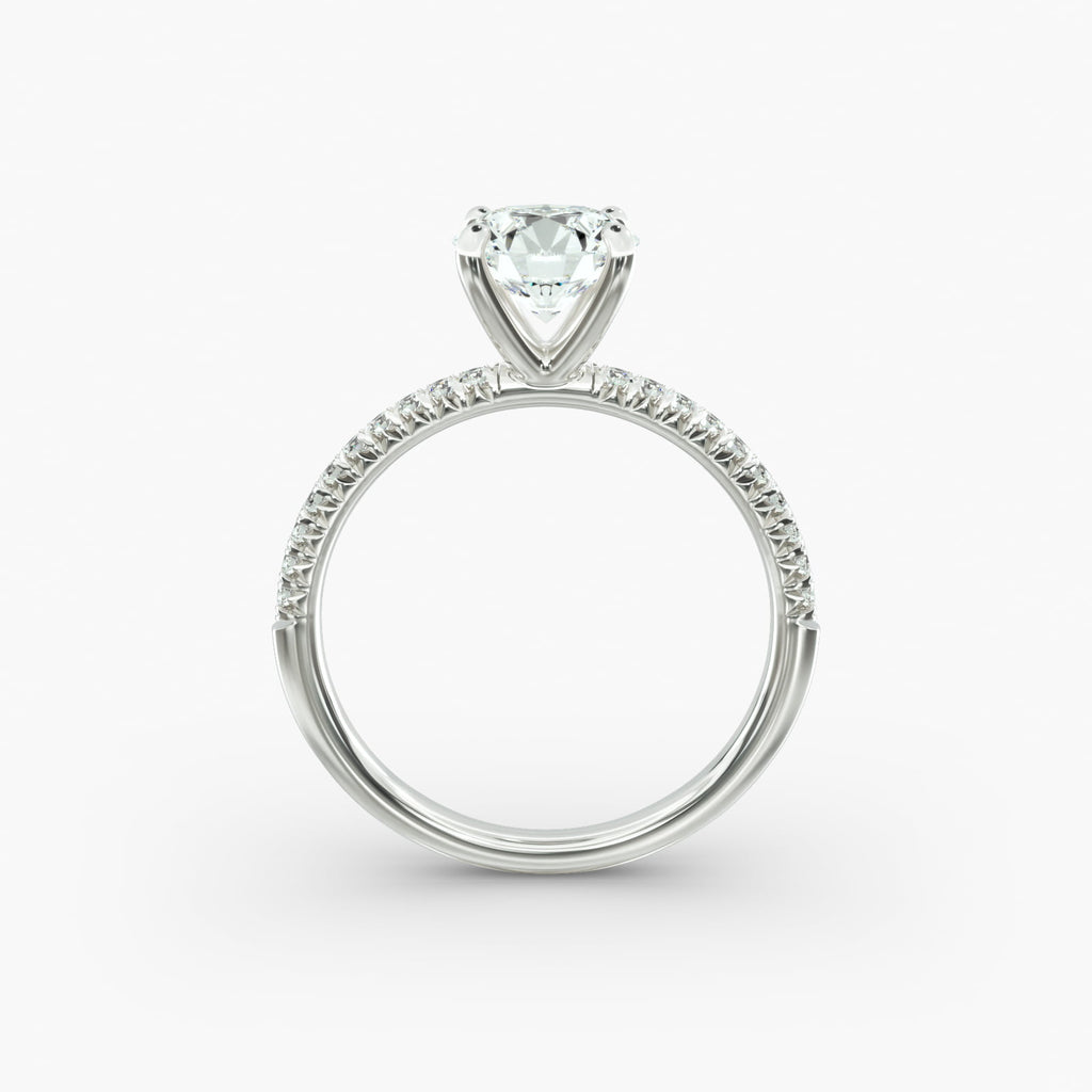 Petite pavé diamond engagement ring in white gold with round diamond