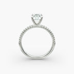 Petite pavé diamond engagement ring in white gold with round diamond