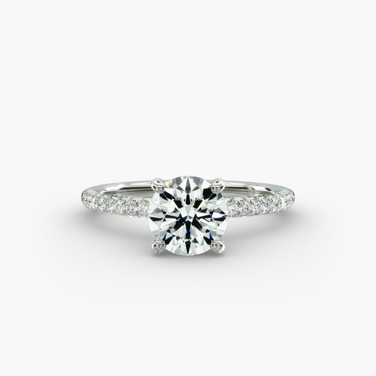 Bridal diamond ring with round solitaire and pavé shoulders