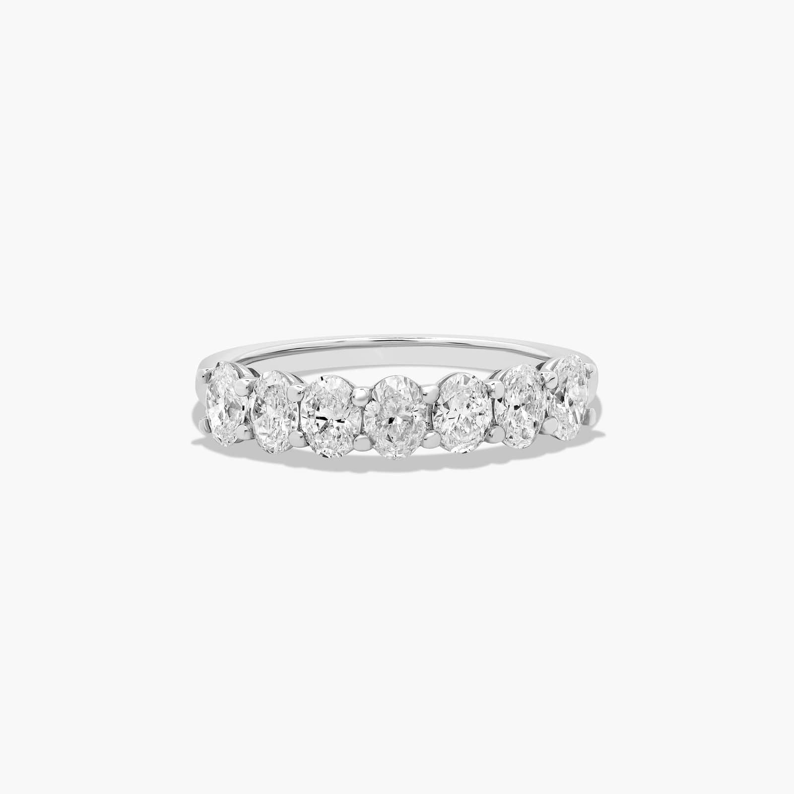 Seven stone oval diamond anniversary ring with elegant white gold band