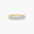 Seven stone oval diamond anniversary ring with elegant gold band