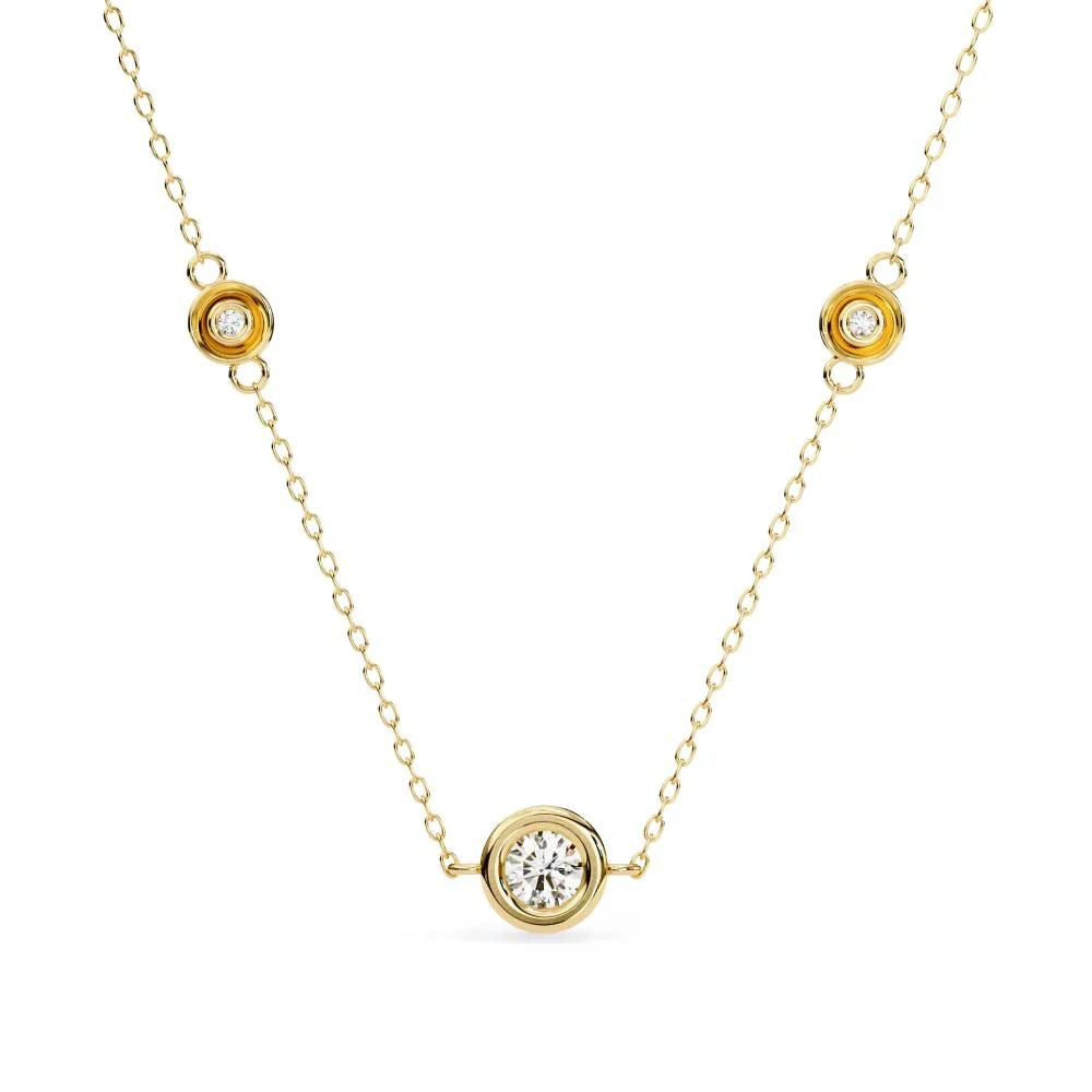 Round bezel-set diamond pendant in gold