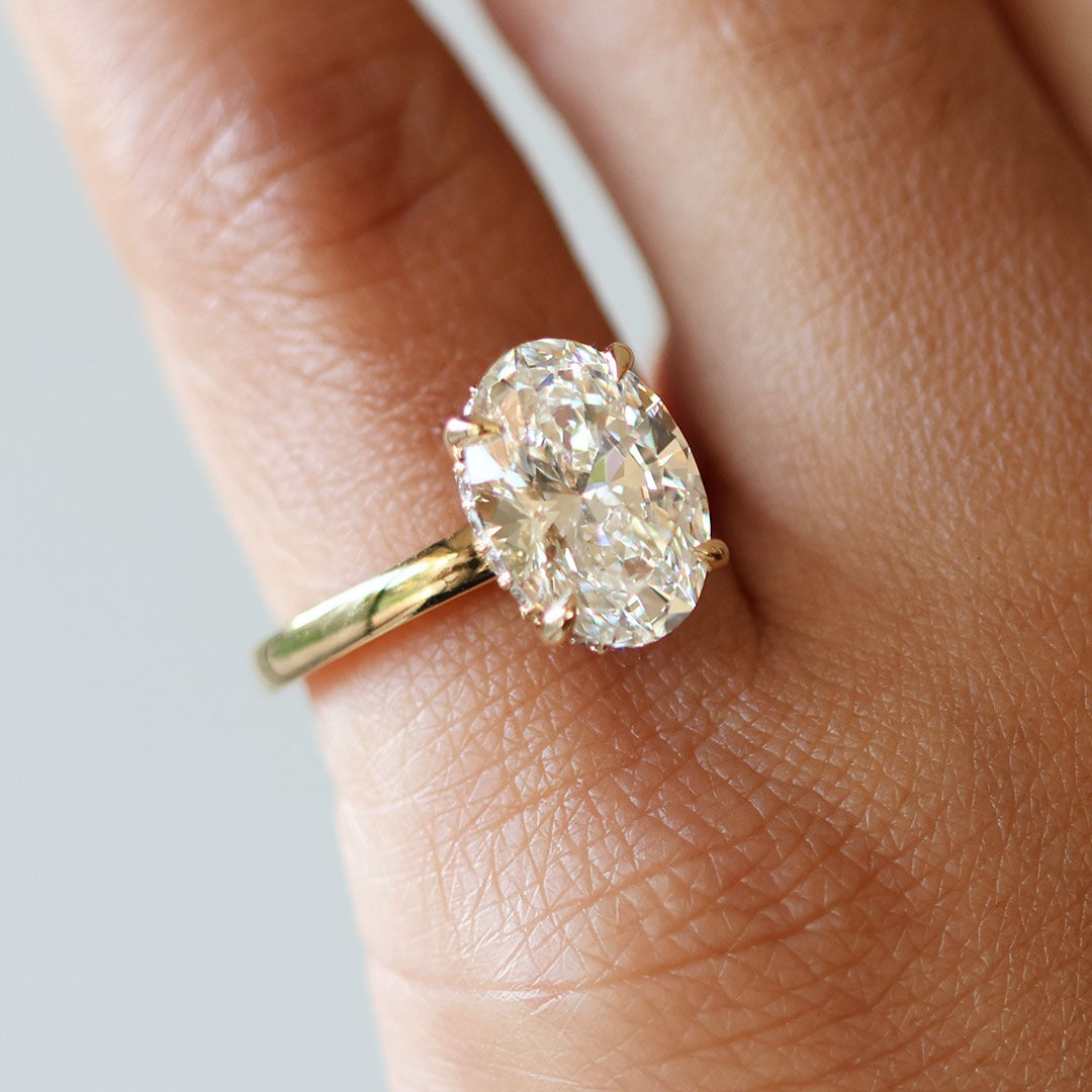 Oval Cut Diamond with Hidden Halo Solitaire Ring in Gold
