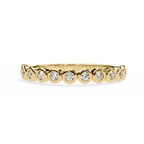 Gold bezel-set diamond wedding band