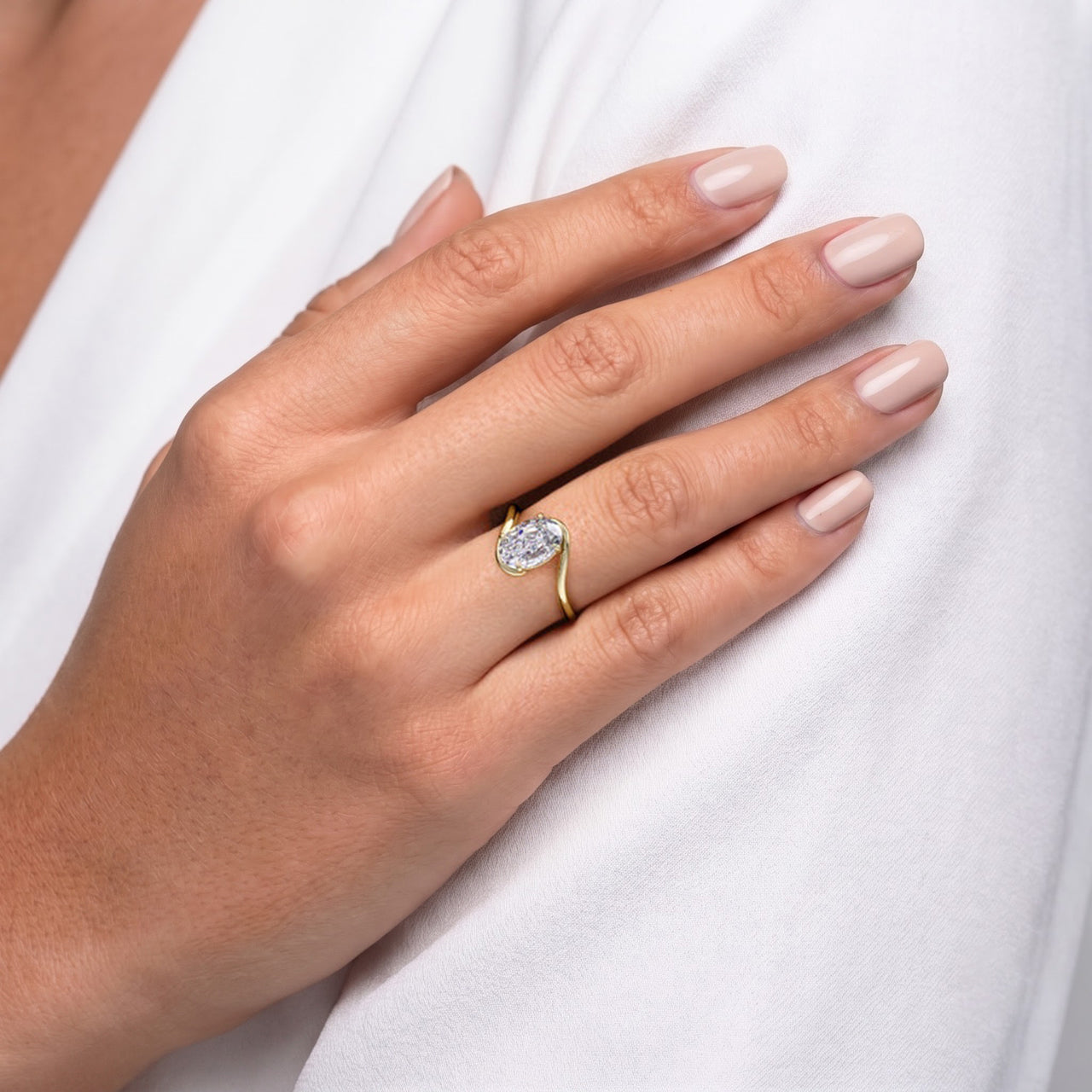 Oval Solitaire Bypass Engagement Ring in Gold