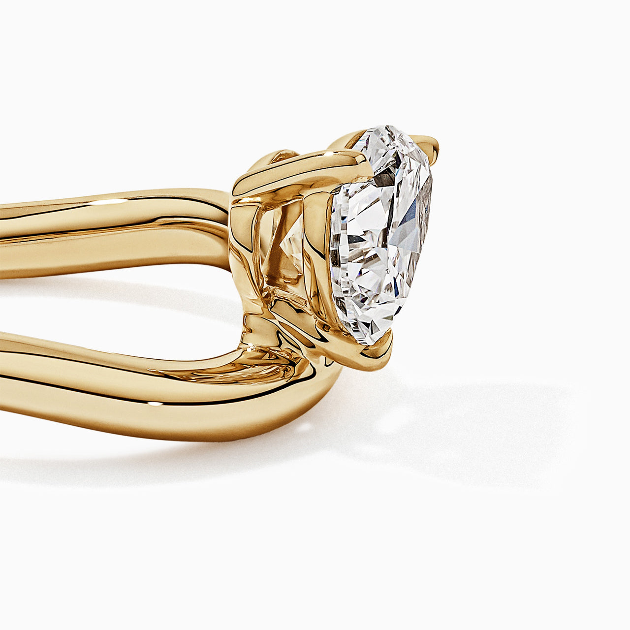 Pear Solitaire Bypass Engagement Ring in Gold
