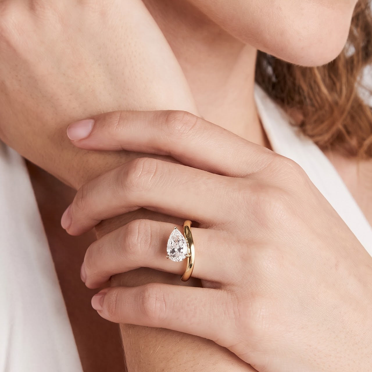 Pear Solitaire Bypass Engagement Ring in Gold