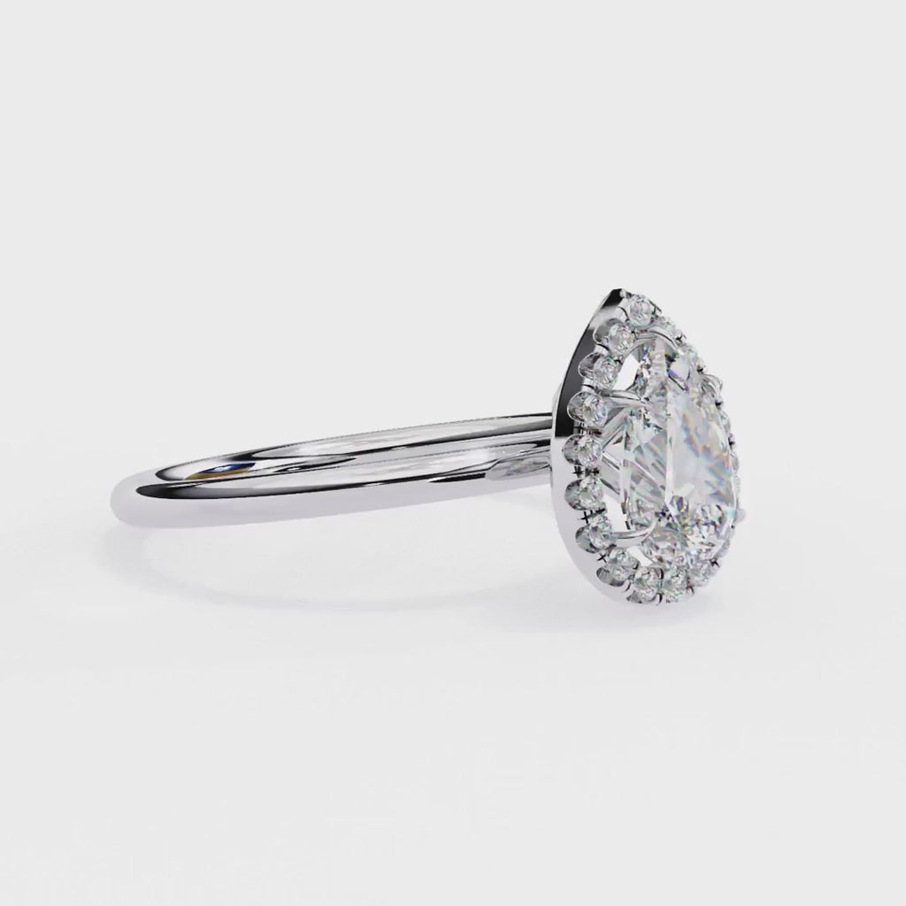 Pear cut diamond halo engagement ring