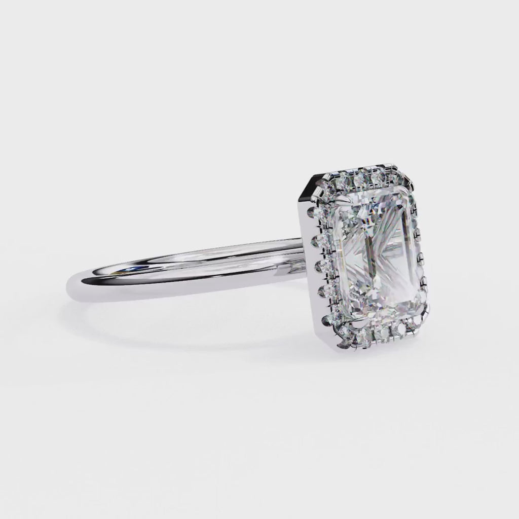 Emerald cut diamond halo engagement ring