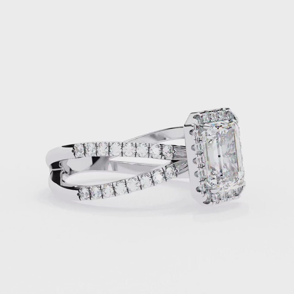 Emerald halo diamond engagment ring with crossover design