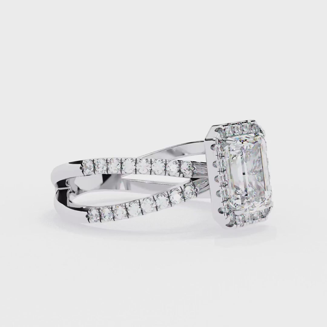 Emerald halo diamond engagment ring with crossover design