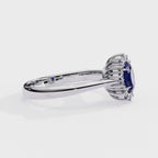 Oval blue sapphire and diamond halo engagement ring 