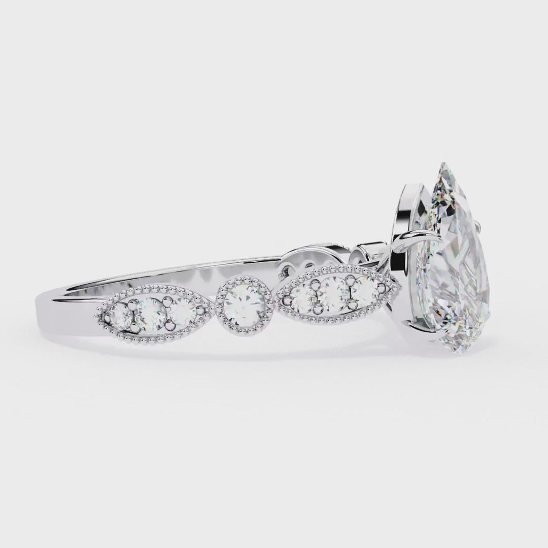 Pear shape diamond ring in Milgrain Cathedral setting