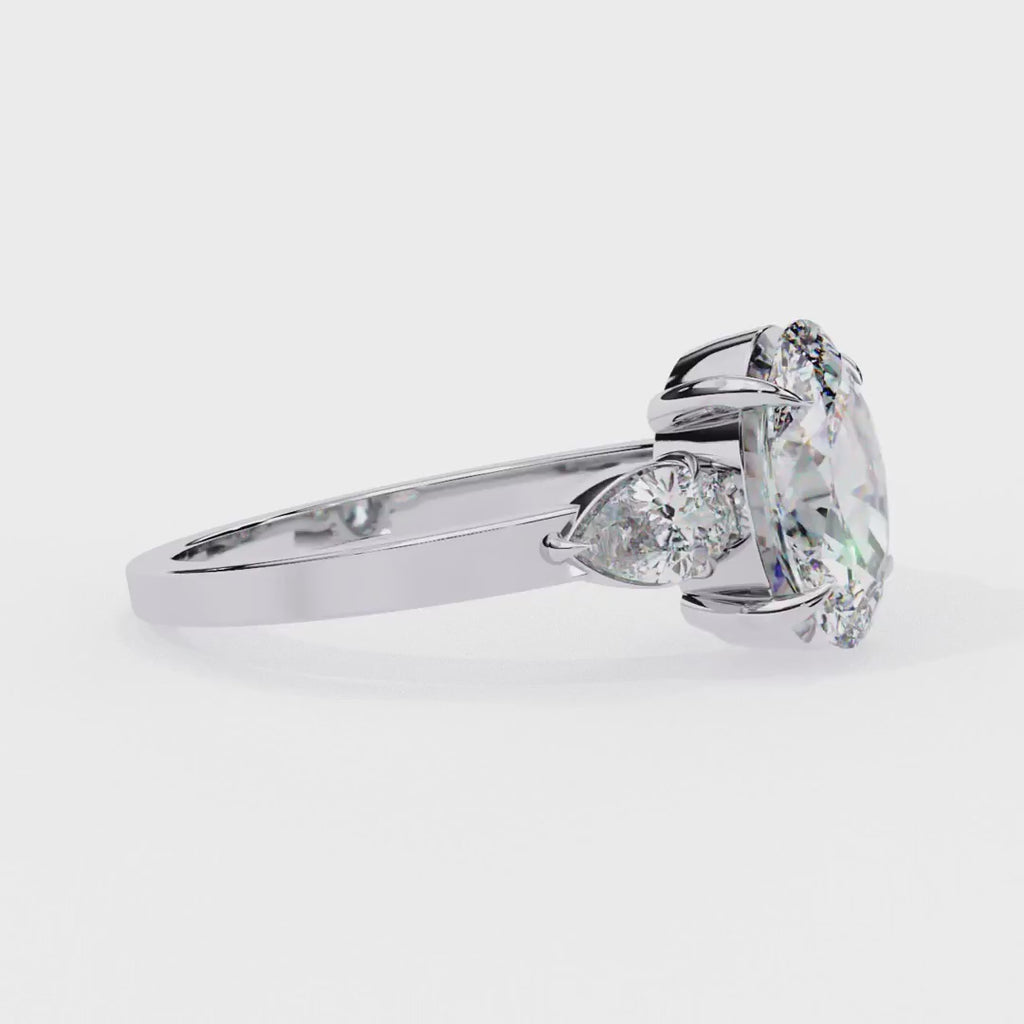 Oval cut three-stone diamond engagement ring