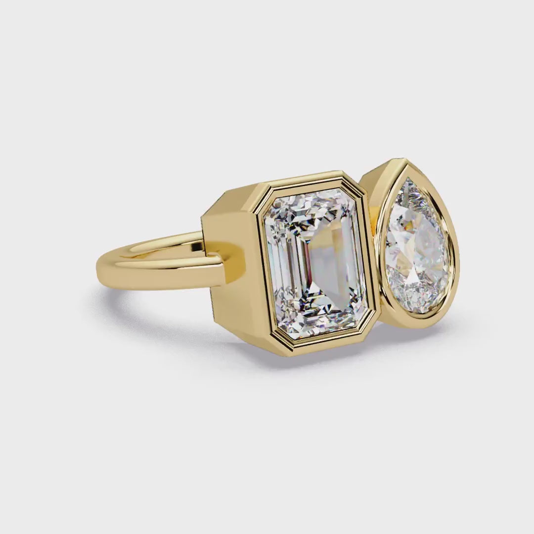 Pear and emerald diamond bezel Toi et Moi engagement ring