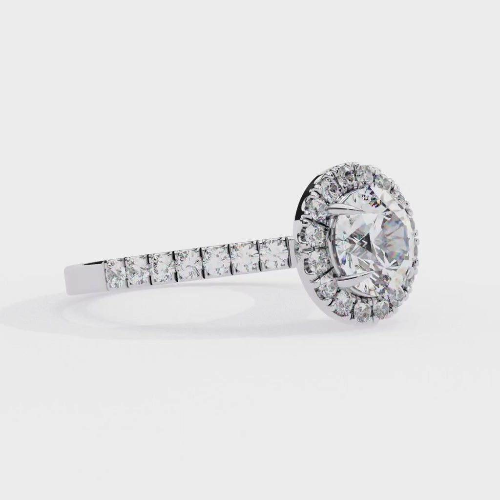 Round halo diamond engagement ring with pavé band