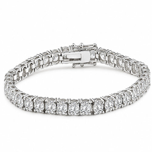 A silver tennis bracelet with round-cut clear stones, shown in a top-down view with a close-up detail strip along the bottom, on a white background.